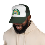 Man wearing a green and white cap with text, smiling on a white background