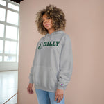 Person wearing a grey hoodie with green 'BILLY' printed on it, standing against a beige wall.