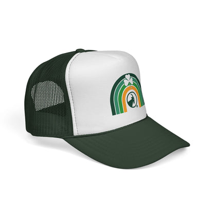 3/4 view. Trucker hat with a rainbow and clover design on a white background
