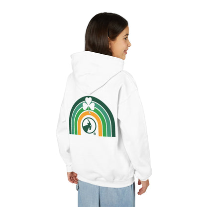 Person wearing a white hoodie with a rainbow and clover design on the back, on a white background