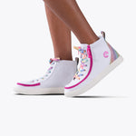 Close-up of SALE - White Rainbow BILLY Classic Lace High kids’ sneakers by BILLY Footwear, featuring rainbow laces, pink trim, glittery iridescent heel detail, and a wraparound zipper, set against a plain white background.