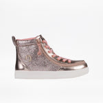 The BILLY Footwear Kids'/Toddler Classic Lace High (Sale) is a glittery pink and silver high top with pink laces, metallic accents, a wraparound zipper, and a white rubber sole, shown on a plain white background.
