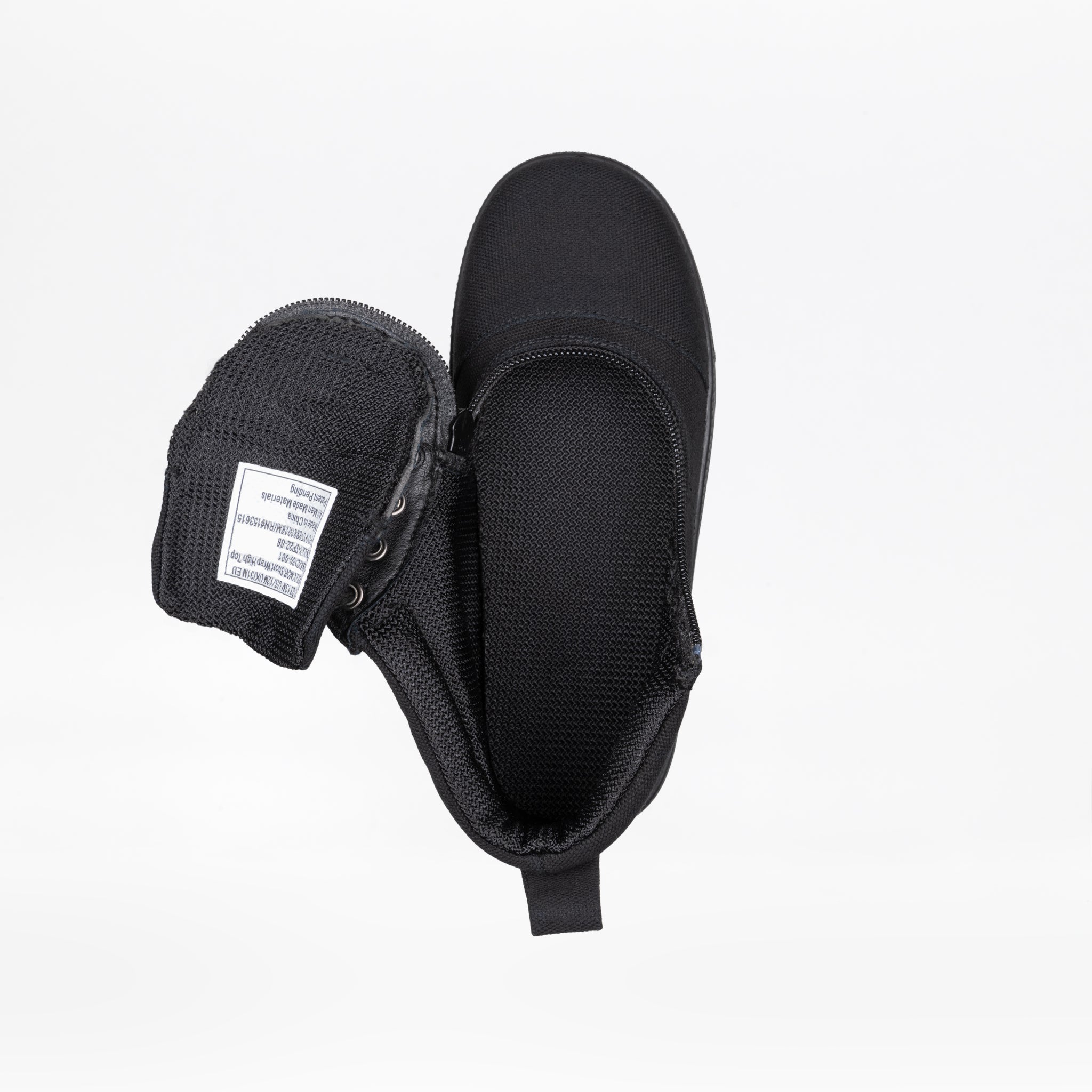 Top view of a FINAL SALE - Black to the Floor BILLY D|R Short Wrap High Top by BILLY Footwear, with its tongue pulled aside to reveal a white inner label. The black AFO-friendly shoe is displayed against a plain white background.