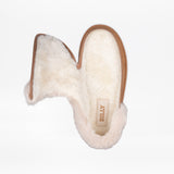 A single Chestnut BILLY Cozy Slipper for women by BILLY Footwear, lined with fluffy white faux fur and shown from above. The unzipped side reveals the soft interior and branded insole, making it ideal for those seeking wide slippers.