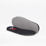 A pair of removable insoles for the BILLY Footwear SALE - Black Leopard BILLY Classic D|R II High, one lying flat with a black top and red logo, the other upright showing a grey underside, both on a white background.