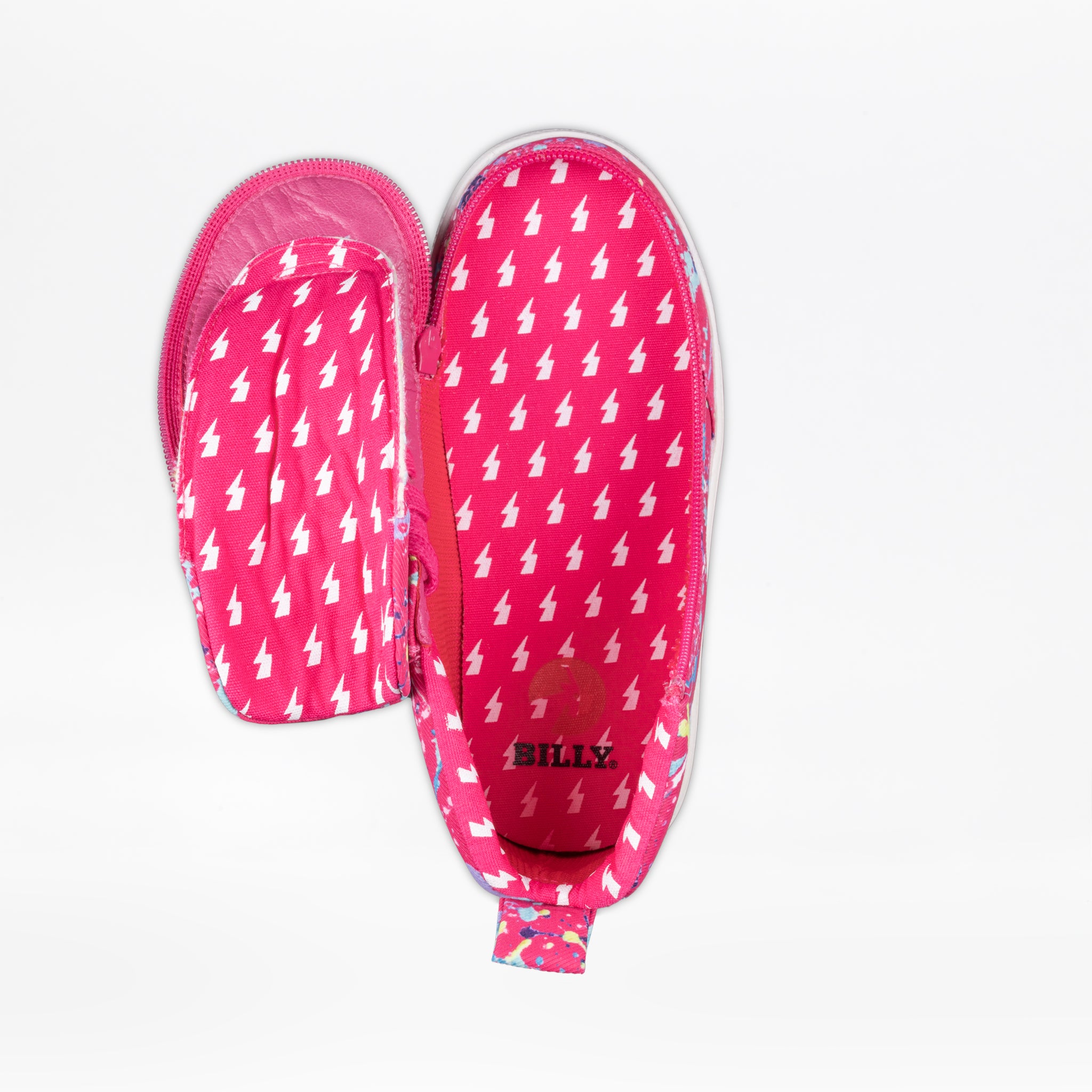 The Sasha Splatter BILLY Classic D|R II High by BILLY Footwear are pink slip-on shoes with a white lightning bolt pattern, featuring wide-opening zippers for easy AFO/orthotic access and the word "BILLY" printed inside.
