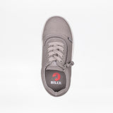 Top view of the SALE - Dark Grey BILLY D|R II Short Wrap Low by BILLY Footwear, a kids’ AFO-friendly gray canvas sneaker with laces, side zipper, and BILLY red wheel logo on the insole. Plain white background.