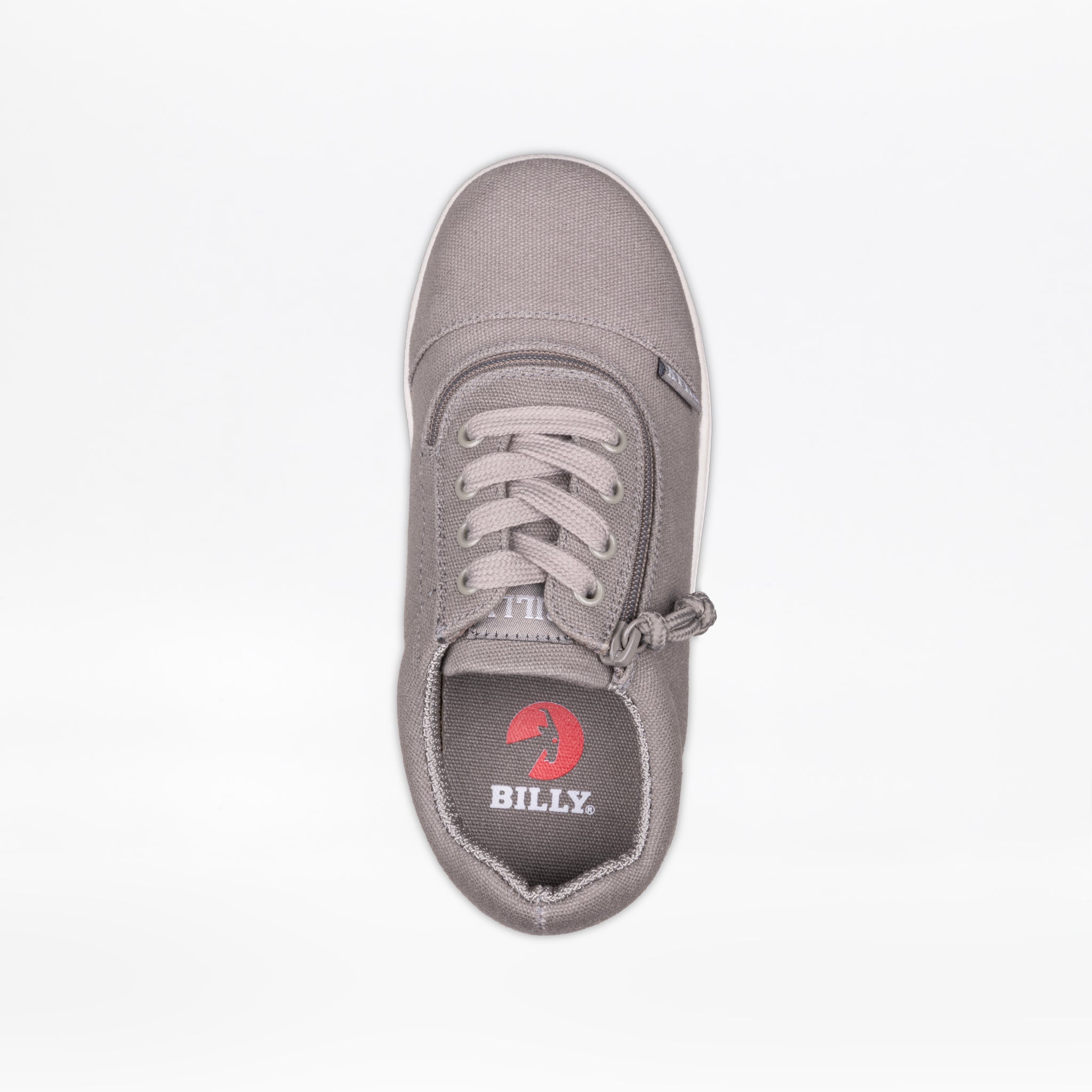 Top view of the SALE - Dark Grey BILLY D|R II Short Wrap Low by BILLY Footwear, a kids’ AFO-friendly gray canvas sneaker with laces, side zipper, and BILLY red wheel logo on the insole. Plain white background.