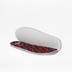 A pair of insoles—one with a white underside and one black with a red animal print—are displayed on a white background, designed for kids’ accessible sneakers like the SALE - Kodify Black BILLY CS High by BILLY Footwear.