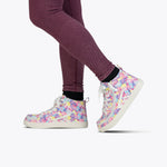 A person wearing maroon ribbed leggings and SALE - Tropical BILLY CS High shoes by BILLY Footwear, featuring a vibrant floral pattern and full wrap zipper, stands on a light background.