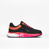The SALE - Black/Fuchsia Fire BILLY Sport Inclusion by BILLY Footwear is a kids’ black athletic sneaker with pink and orange accents, splash sole design, and laces, shown against a plain white background.