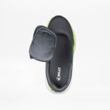 The SALE - Smoke/Lime Fire BILLY Sport Inclusion by BILLY Footwear is a dark gray kids’ slip-on sneaker with a soft, padded flap, neon green sole, and adaptive design. The insole is labeled BILLY. Shown on a white background.