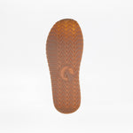 Close-up of a brown rubber sole from the Lilac BILLY Retro Jogger by BILLY Footwear, featuring a herringbone tread and central circular logo, shown against a plain white background.