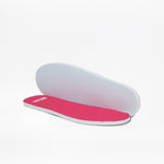 Two insoles for the Fuchsia BILLY Retro Jogger by BILLY Footwear feature bright pink tops and white bottoms. Shown on a white background, one lies flat while the other is propped up to display both sides.