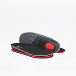 A pair of Black BILLY Limitless insoles by BILLY Footwear with red and gray accents are shown, one flat and one on its edge to display the textured sole and red cushioned heel area.