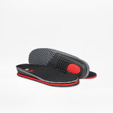 A pair of Black BILLY Limitless insoles by BILLY Footwear with red and gray accents are shown, one flat and one on its edge to display the textured sole and red cushioned heel area.