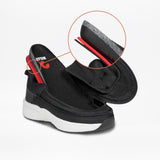 The Black BILLY Limitless sneaker by BILLY Footwear is shown with its tongue lifted to display the interior. A circular inset provides a close-up of the white sole’s layered construction.