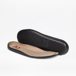 Black and beige shoe insoles on a white background