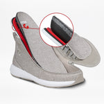 A Men's Grey Jersey BILLY Goat Classic High sneaker by BILLY Footwear is cut open, revealing foam, mesh, and fabric layers inside. A red circle highlights its construction. The wide-fit shoe has white soles and textured grey jersey fabric.