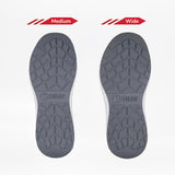 Two gray Men's Charcoal BILLY Sport Inclusion shoe soles by BILLY Footwear are shown side by side on a white background. The left sole is labeled Medium, the right is labeled Wide, highlighting the shoes’ inclusive fit.