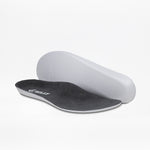 Two charcoal/yellow BILLY Footwear insoles for men's Inclusion Trail shoes are shown on a white background—one lies flat to display the branded top, while the other is propped to reveal its contoured underside.