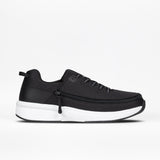 The Men's Black BILLY Limitless by BILLY Footwear features a mesh upper, black laces, thick white sole, and visible side zipper for easy on/off. Displayed in profile against a white background.