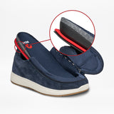 The Men's Navy Suede BILLY Comfort Plush from BILLY Footwear is partly unzipped to reveal its inner structure. A circular inset magnifies the heel, showcasing the layered, sensory-friendly construction and white sole.