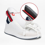 The Men's White/Navy BILLY Comfort Court by BILLY Footwear features a white zipper upper revealing a black and red insole. A circular inset highlights the layered sole construction, showcasing these stylish men’s fashion shoes.