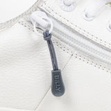 Charcoal sport zipper pull with BILLY word mark attached to a white shoe
