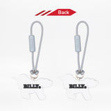 Two unicorn zipper pulls with 'BILLY' engraved on the back, attached to strings, on a white background.