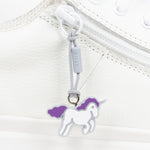 White shoe with a unicorn zipper pull on a white background
