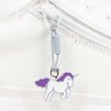 White shoe with a unicorn zipper pull on a white background