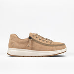 A women's tan suede sneaker with a wraparound zipper and lace-up closure.