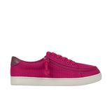 Pink sneaker with a white sole on a white background