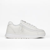 The Women's White Leather BILLY Comfort Plush by BILLY Footwear features laces, a wraparound zipper, plush comfort, a thick textured sole, and minimal stitching for a modern look. Shown in profile on a plain white background.
