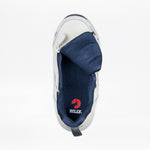The Women's White/Navy BILLY Limitless 253 by BILLY Footwear is shown from above with an open side zipper, revealing the red BILLY logo insole, a folded tongue, sensory friendly design, and dark blue mesh lining.
