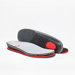 A pair of Women's Grey BILLY Comfort Knit insoles by BILLY Footwear, featuring gray tops, red accents, and black textured bottoms—one upright to show the sole, the other flat to display the top surface.