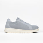 A grey Women's Comfort Knit sneaker by BILLY Footwear with a white sole, shown in profile on a white background. This low-top, breathable shoe features a perforated design and a medial zipper.