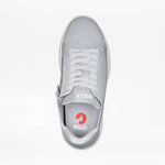 A top view of the Women's Grey BILLY Comfort Knit by BILLY Footwear shows white laces, a medial zipper, and "BILLY" branding on the tongue and insole with a red circular logo. This breathable sneaker combines style with convenience.