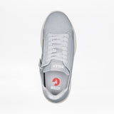 A top view of the Women's Grey BILLY Comfort Knit by BILLY Footwear shows white laces, a medial zipper, and "BILLY" branding on the tongue and insole with a red circular logo. This breathable sneaker combines style with convenience.
