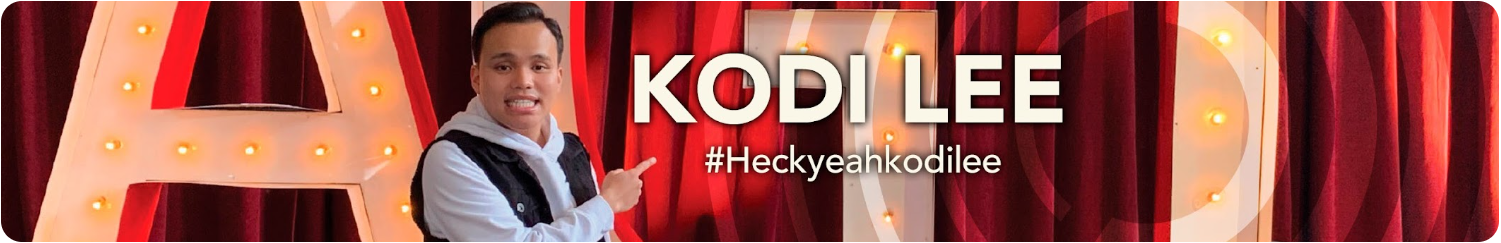 Image of Kodi in front of red curtain of marquee sign 
