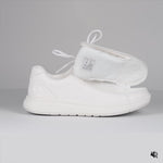 Video showing White shoe opened then closed with a wraparound zipper