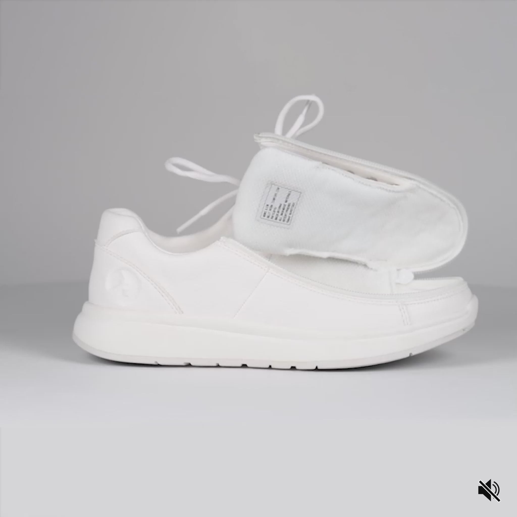Video showing White shoe opened then closed with a wraparound zipper