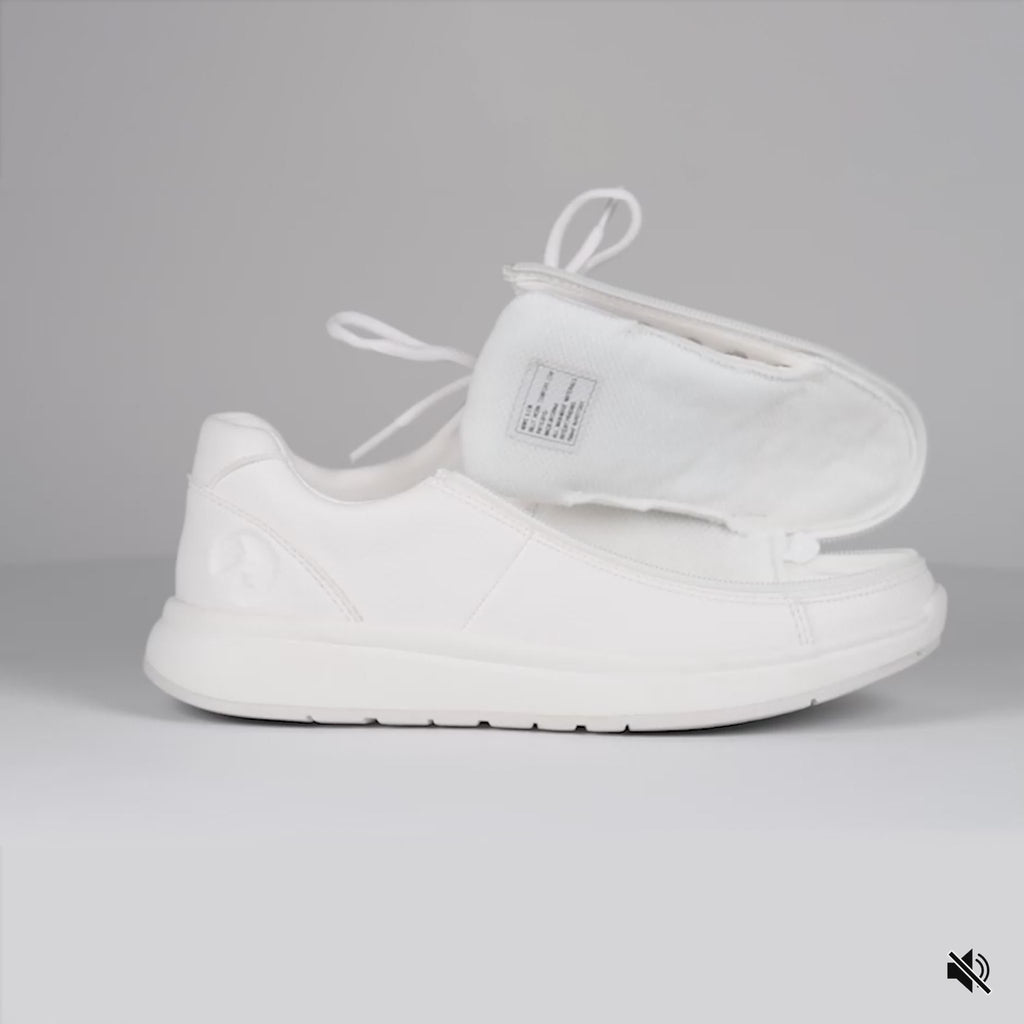 Video showing White shoe opened then closed with a wraparound zipper