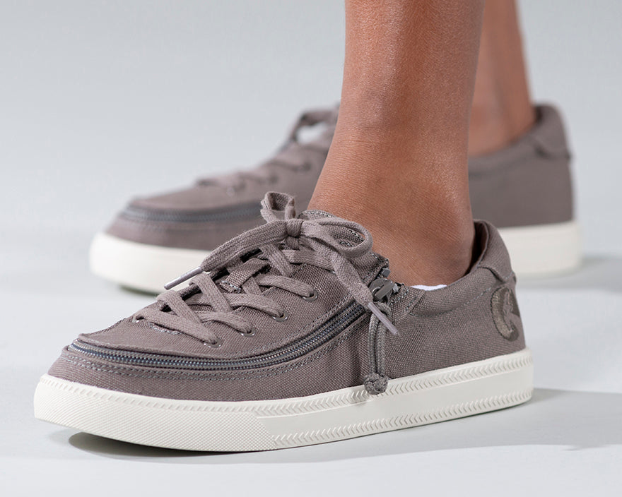 Kid's Dark Grey BILLY Classic Lace Lows, zipper shoes, like velcro, that are adaptive, accessible, inclusive and use universal design to accommodate an afo. Footwear is medium and wide width, M, D and EEE, are comfortable, and come in toddler, kids, mens, and womens sizing.